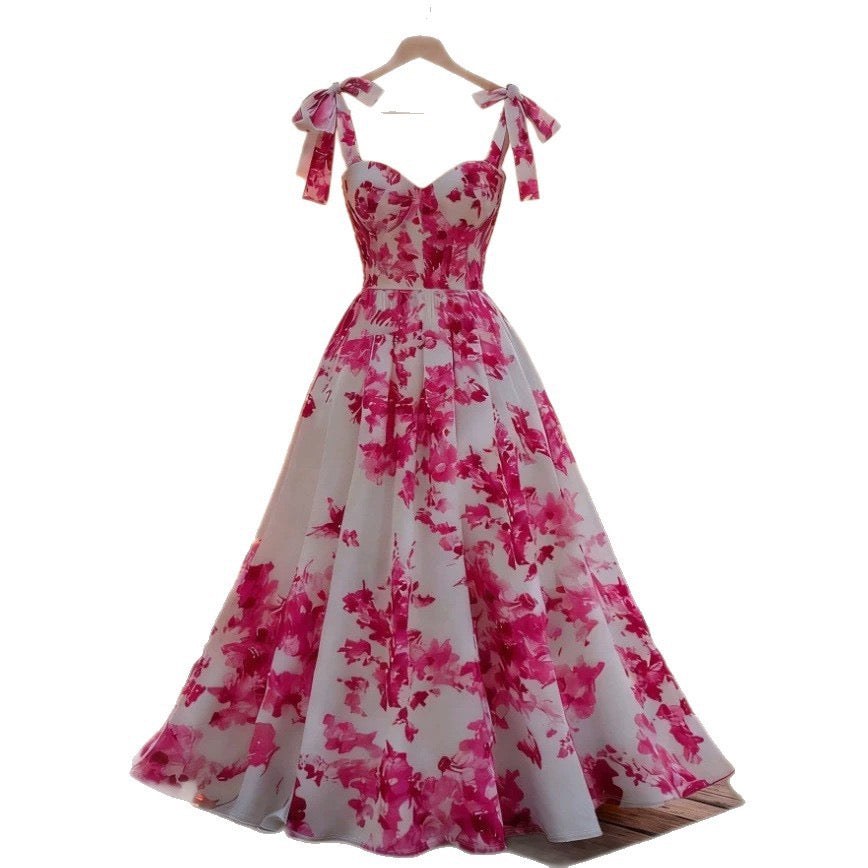 Popular pink floral print sundress from European and American cross-border e-commerce platforms. Slimming, flattering, and stylish A-line dress perfect for a vacation.